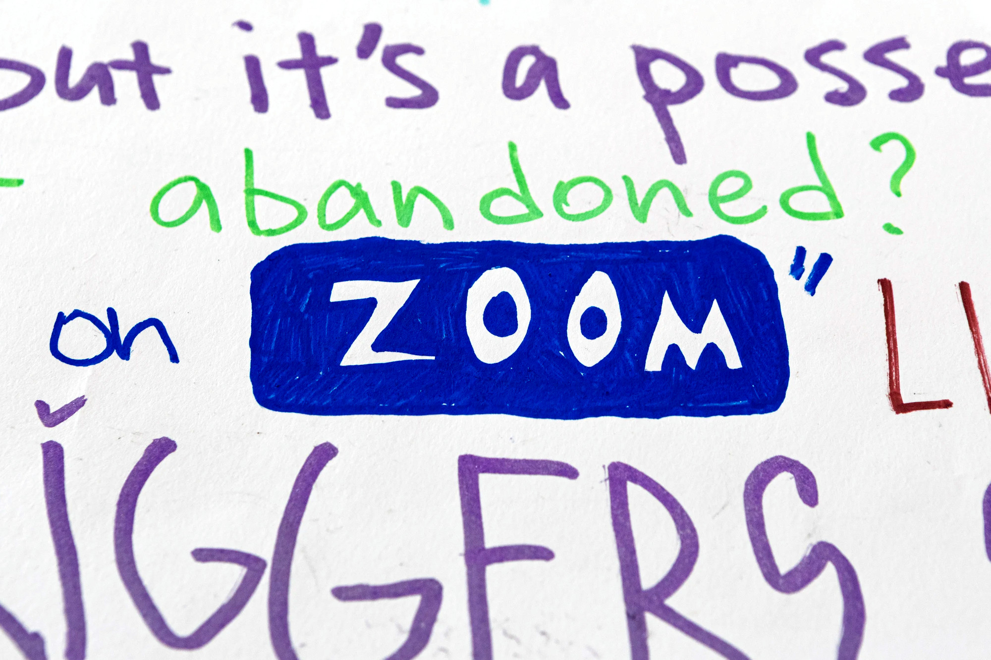 Detail: handwritten lines reading “but it’s a posse… abandoned? on ZOOM”, the word ZOOM drawn as the app’s blue button.