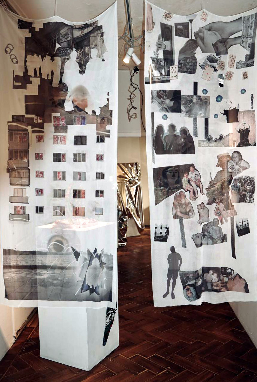 Theirafter, 2026: printed mesh panels hanging either side of a plinth in the gallery.